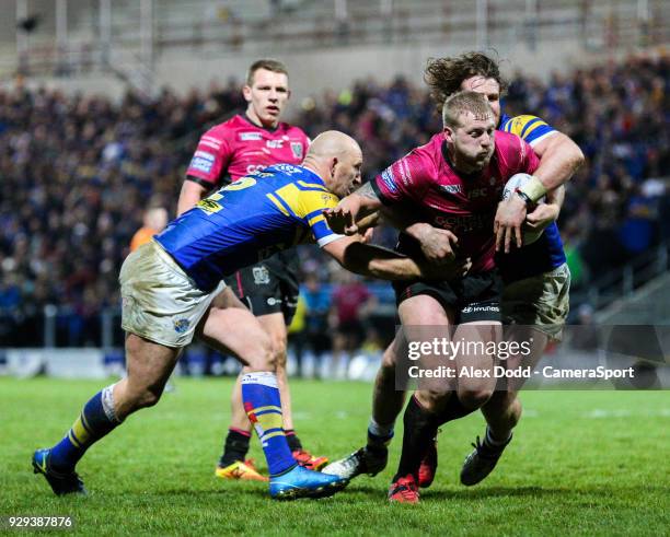 Hull FC 's Jordan Abdull is tackled by Leeds Rhinos' Carl Ablett and Anthony Mullally during the Betfred Super League Round 5 match between Leeds...