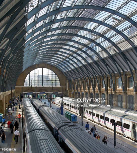 King's Cross trainshed, London, United Kingdom. Architect: Network Rail, 2013. Restored twin trainsheds, letting light flood back in to the station.
