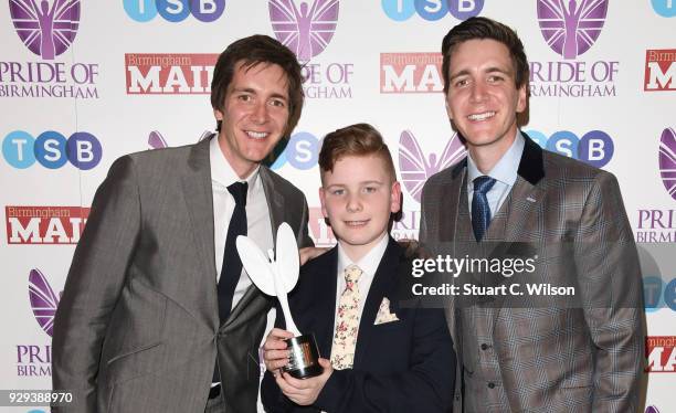 Young Fundraiser of the year, Tristan Price, poses with Oliver and James Phelps in the winner's room at the Pride Of Birmingham Awards 2018 at...