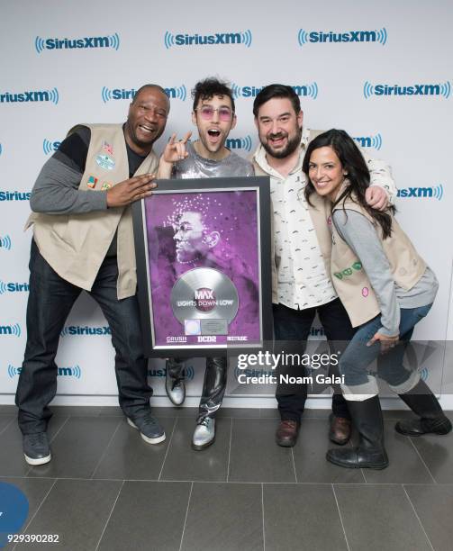 Stanley T, MAX, Ryan Sampson and Nicole Ryan pose for a photo with MAX's Platinum record plaque at SiriusXM Studios on March 8, 2018 in New York City.