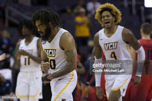 Jonathan Williams and Justin Tillman of the Virginia Commonwealth Rams react against the Dayton Flyers in the second round of the Atlantic 10...