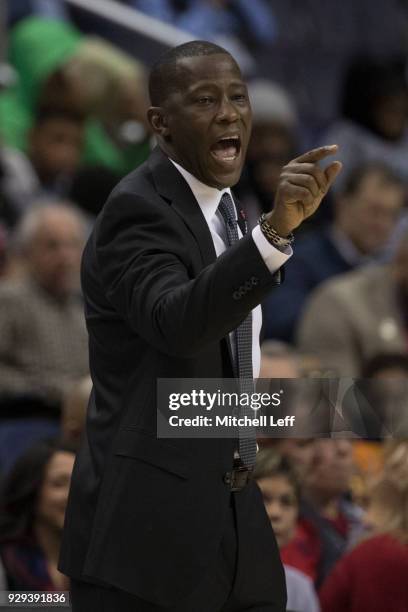 Head coach Anthony Grant of the Dayton Flyers talks to his team in the game against the Virginia Commonwealth Rams in the second round of the...