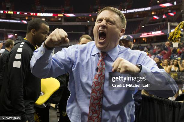 Head coach Mike Rhoades of the Virginia Commonwealth Rams celebrates as he walks off the court against the Dayton Flyers in the second round of the...