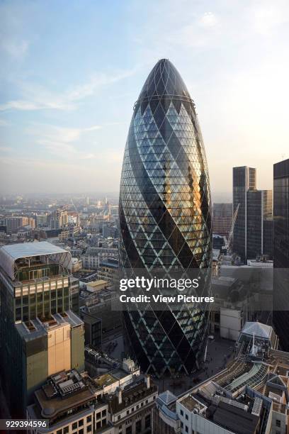 Elevated view of City of London with skyline. The Gherkin, London, United Kingdom. Architect: Foster + Partners, 2004.