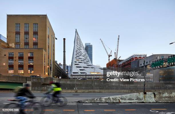 View across Joe DiMaggio highway towards VI› 57 in context. VI› 57, New York, United States. Architect: BIG Bjarke Ingels Group, 2016.