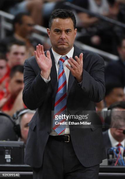 Head coach Sean Miller of the Arizona Wildcats claps during a quarterfinal game of the Pac-12 basketball tournament against the Colorado Buffaloes at...