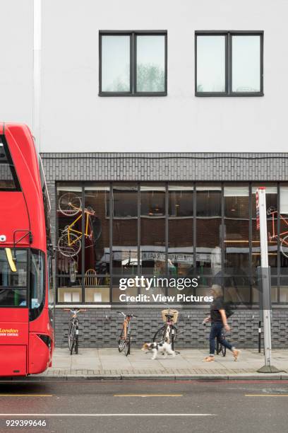 Detailed view across street towards brick facade with Crittall windows. Ace Hotel Shoreditch, London, United Kingdom. Architect: EPR Architects...