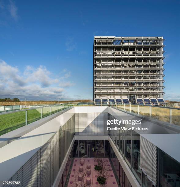 Elevated view from green roof towards interior courtyard and service tower. Gas Networks Ireland, Dublin, Ireland. Architect: Denis Byrne Architects,...