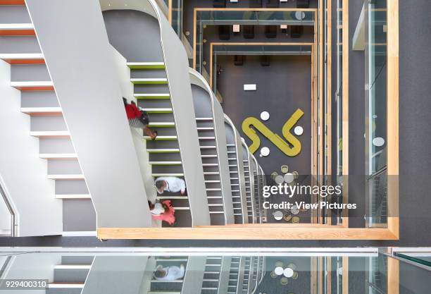 Bird's eye view into multi-storey foyer with staircases. 5 Pancras Square, London, United Kingdom. Architect: Bennetts Associates Architects, 2014.