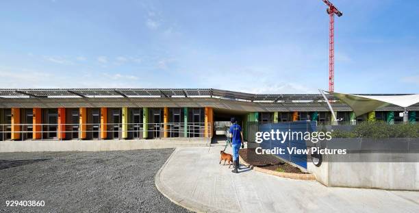 Approach and front elevation of individual kennel sections. Battersea Dogs & Cats Home, London, United Kingdom. Architect: Jonathan Clark Architects,...