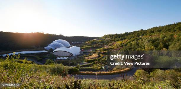 Back light view with landscaping and biomes. Eden Project, Bodelva, United Kingdom. Architect: Grimshaw, 2016.