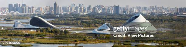 Panoramic aerial view of opera house embedded in Harbin's wetland landscape. Harbin Opera House, Harbin, China. Architect: MAD Architects, 2015.