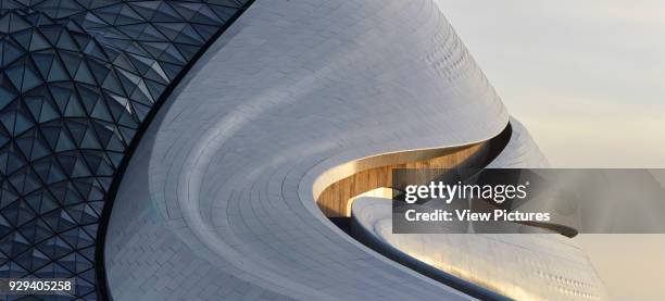 Glazing and aluminium cladding of exterior. Harbin Opera House, Harbin, China. Architect: MAD Architects, 2015.