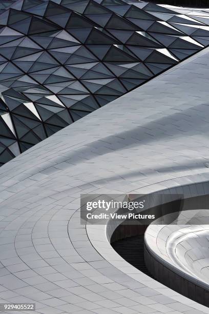 Curvaceous exterior facade with glazing and cladding. Harbin Opera House, Harbin, China. Architect: MAD Architects, 2015.