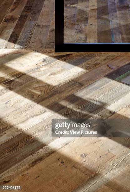 Detail of reclaimed 16th century flooring with sunlight. 54 Brooks Mews, London, United Kingdom. Architect: Stiff + Trevillion Architects, 2016.