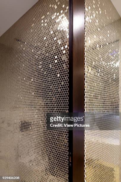 Detail of gold mosaic style tiled bathroom. 54 Brooks Mews, London, United Kingdom. Architect: Stiff + Trevillion Architects, 2016.