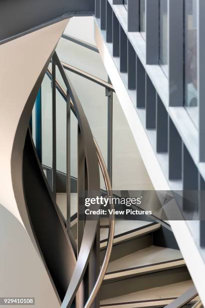 Spiral staircase and first floor screen. The Office in the Park, Greenford, United Kingdom. Architect: Dannatt, Johnson Architects, 2015.