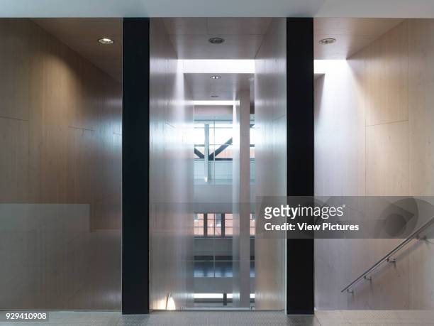 View through interior of stairwell landing. Fire Station Dordrecht, Dordrecht, Netherlands. Architect: Rene van Zuuk, 2011.