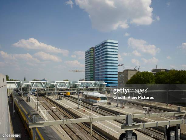 Arnhem Central Station, Arnhem, Netherlands. Architect: UNStudio, 2014. Elevated view towards tracks and platform roofs.