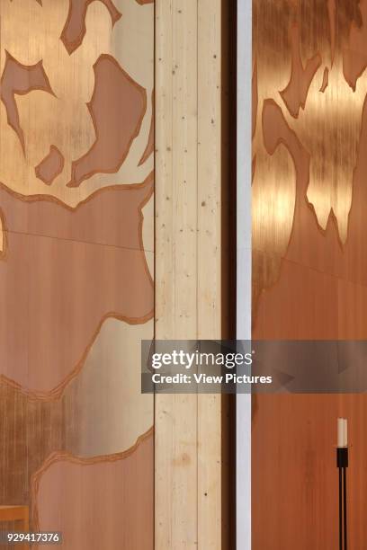 Viikki Church, Helsinki, Finland. Architect: JKMM Architects, 2005. Detail of Elaman puu altarpiece in mahogany with punched silver decoration, with...