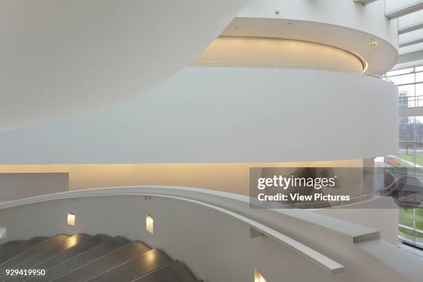 Detail of spiral staircase leading down through atrium. ARoS Aarhus Kunstmuseum, Aarhus, Denmark. Architect: schmidt hammer lassen, 2004.