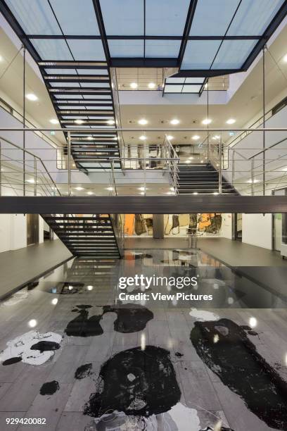 Atrium with water feature and main staircase seen from ground floor. IBC Kolding Campus, Kolding, Denmark. Architect: schmidt hammer lassen...