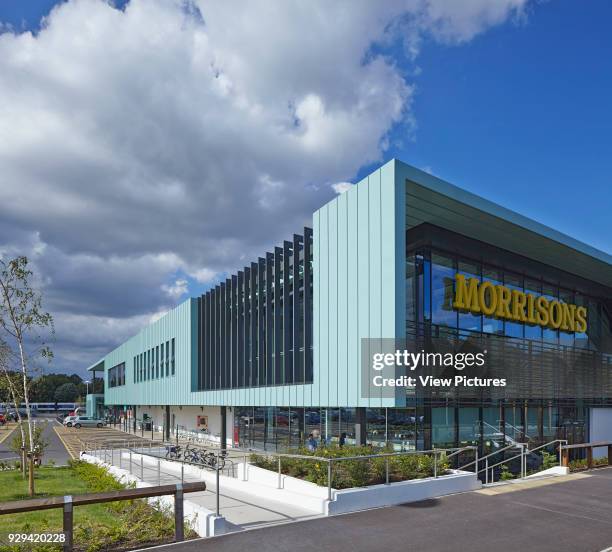 Morrisons Leamington Spa, Royal Leamington Spa, United Kingdom. Architect: Aukett Architects, 2013. Corner elevation from street with store signage.