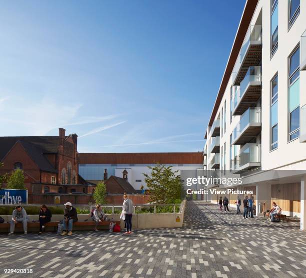 Streatham Hub Leisure Development, London, United Kingdom. Architect: Michael Aukett Architects Limited, 2014. Public realm, balcony with wire chairs.