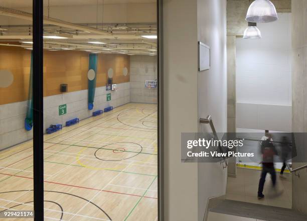 Streatham Hub Leisure Development, London, United Kingdom. Architect: Michael Aukett Architects Limited, 2014. Staircase and window to sports hall.