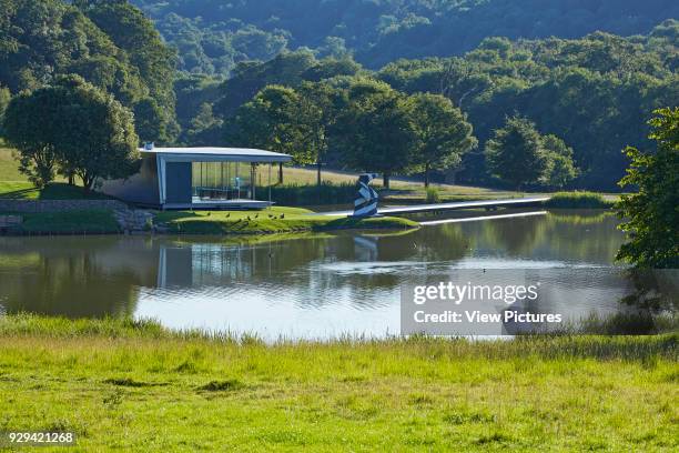 Lake with island pavilion. Island Pavilion and Footbridge, High Wycombe, United Kingdom. Architect: Snell Associates, 2014.