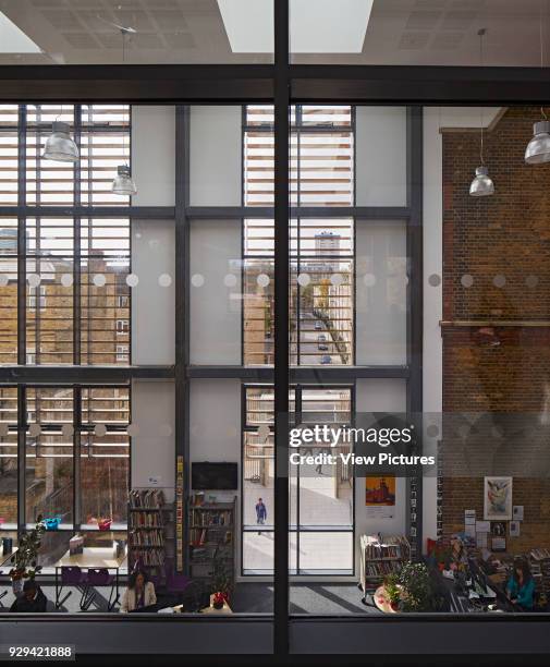 Internal view through from upper floor to ground floor library. Regent High School, London, United Kingdom. Architect: Walters and Cohen Ltd, 2015.