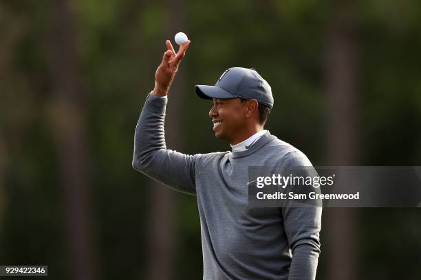 Tiger Woods reacts after playing his shot plays rom the 17th tee during the first round of the Valspar Championship at Innisbrook Resort Copperhead...