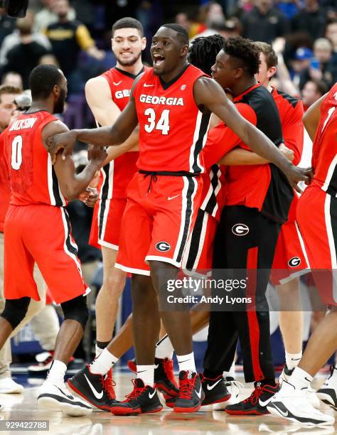 Derek Ogbeide of the Georgia Bulldogs celebrates after the 62-60 win over the Missouri Tigers during the second round of the 2018 SEC Basketball...