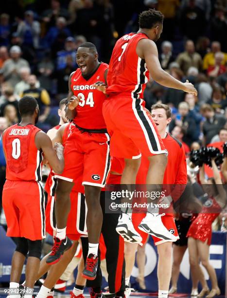 Derek Ogbeide of the Georgia Bulldogs celebrates with Yante Maten after the 62-60 win over the Missouri Tigers during the second round of the 2018...