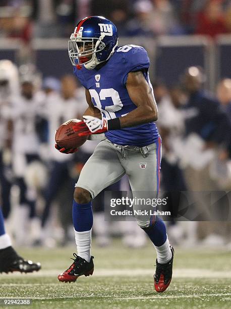 Mario Manningham of the New York Giants runs the ball against the San Diego Chargers at Giants Stadium on November 8, 2009 in East Rutherford, New...