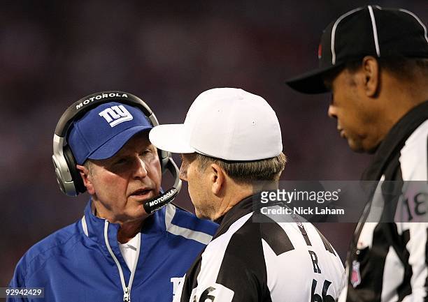 Head coach of the New York Giants Tom Coughlin talks with referee Walt Anderson against the San Diego Chargers at Giants Stadium on November 8, 2009...