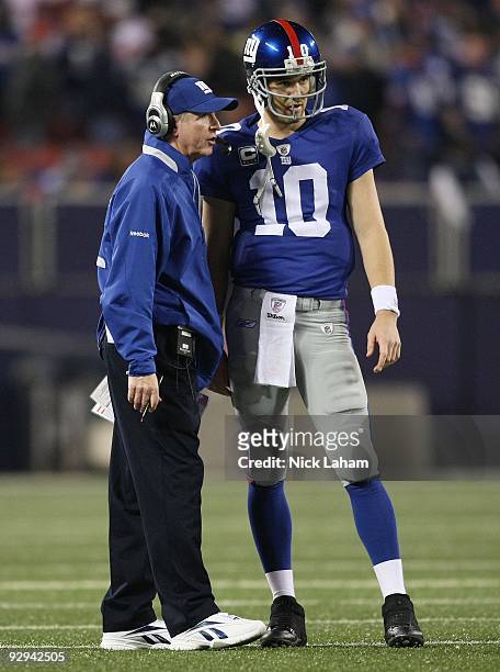 Head coach of the New York Giants Tom Coughlin talks with Eli Manning against the San Diego Chargers at Giants Stadium on November 8, 2009 in East...