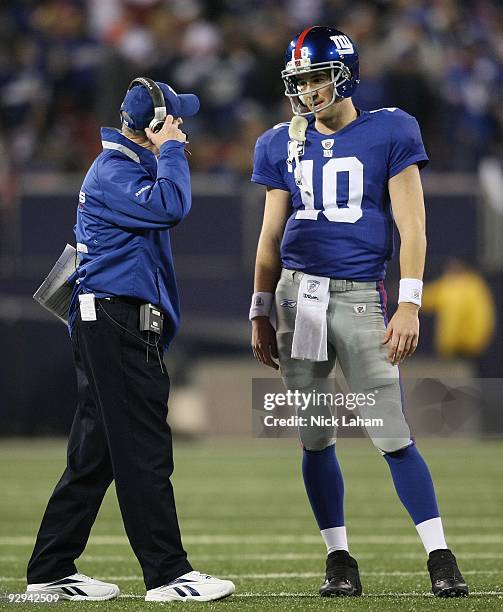 Head coach of the New York Giants Tom Coughlin talks with Eli Manning against the San Diego Chargers at Giants Stadium on November 8, 2009 in East...