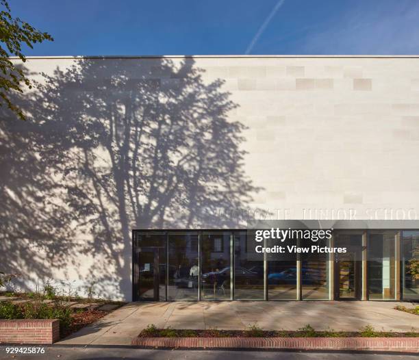 Light and shadow on Portland Stone entrance facade. Highgate Shool, London, United Kingdom. Architect: Architype Limited, 2016.