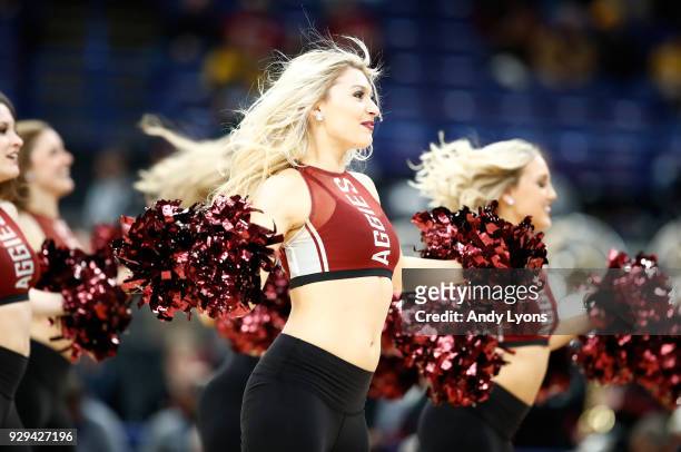 Texas A&M Aggies cheerleaders perform in the game against the Alabama Crimson Tide during the second round of the 2018 SEC Basketball Tournament at...