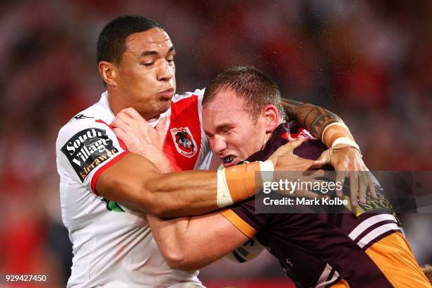 Tyson Frizell of the Dragons tackles Matthew Lodge of the Broncos during the round one NRL match between the St George Illawarra Dragons and the...