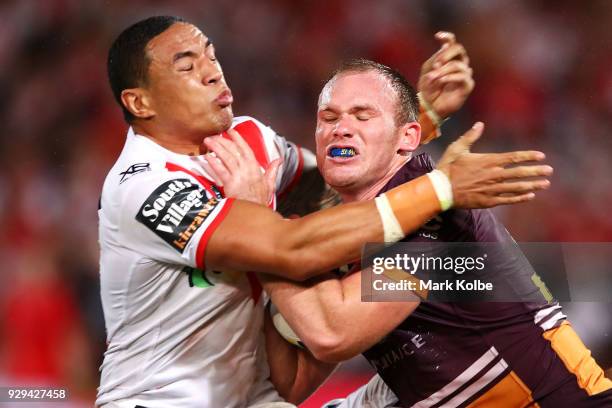 Tyson Frizell of the Dragons tackles Matthew Lodge of the Broncos during the round one NRL match between the St George Illawarra Dragons and the...