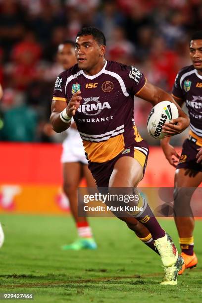 Tevita Pangai of the Broncos runs the ball during the round one NRL match between the St George Illawarra Dragons and the Brisbane Broncos at UOW...