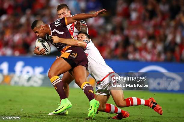 Jamayne Isaako of the Broncos is tackled during the round one NRL match between the St George Illawarra Dragons and the Brisbane Broncos at UOW...