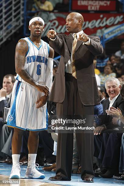 Bobby Brown and head coach Byron Scott of the New Orleans Hornets talk during the game against the Dallas Mavericks on November 4, 2009 at the New...