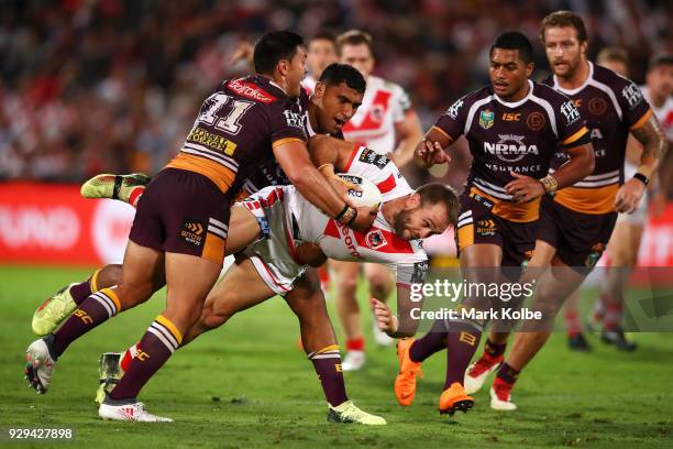 Jason Nightingale of the Dragons is tackled during the round one NRL match between the St George Illawarra Dragons and the Brisbane Broncos at UOW...