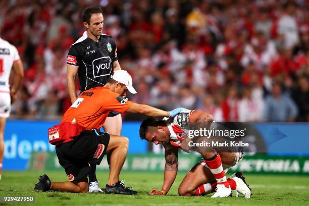 Paul Vaughan of the Dragons receives attention from the trainer during the round one NRL match between the St George Illawarra Dragons and the...