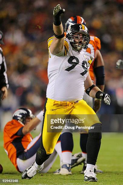 Brett Keisel of the Pittsburgh Steelers celebrates after a sack in the second quarter against the Denver Broncos at Invesco Field at Mile High on...