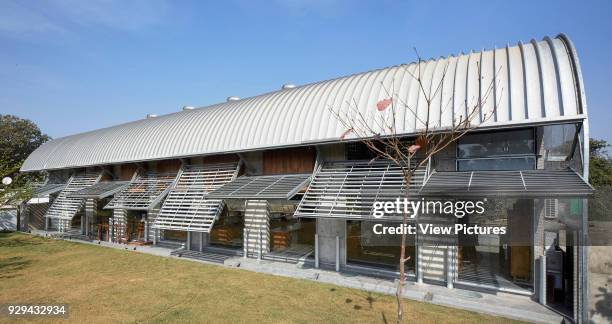 Garden side exterior view. The Pool Studio of Matharoo Associates, Ahmedabad, India. Architect: Matharoo Associates, 2016.