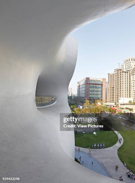 Overall view looking out through organic facade. National Taichung Theater, Taichung, China. Architect: Toyo Ito, 2016.